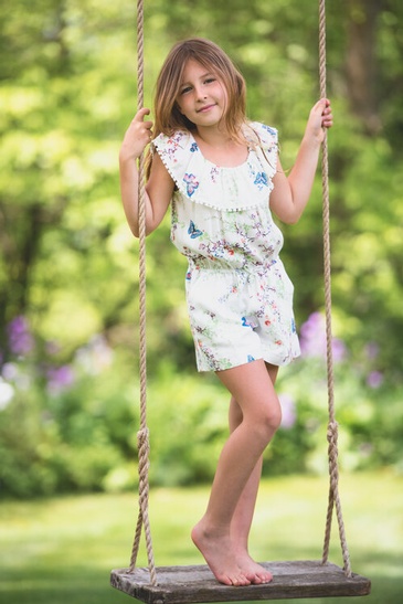 Young Girl Standing on a Swing Captured by Devon Crowell - Family Photography Guelph
