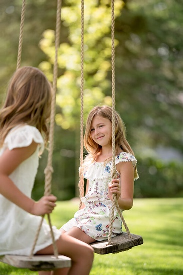 Siblings on Swing in a Park - Family Photography Burlington by Devon Crowell