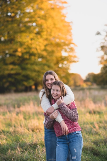 Siblings Hugging - Outdoor Family Photography Kitchener by Devon Crowell