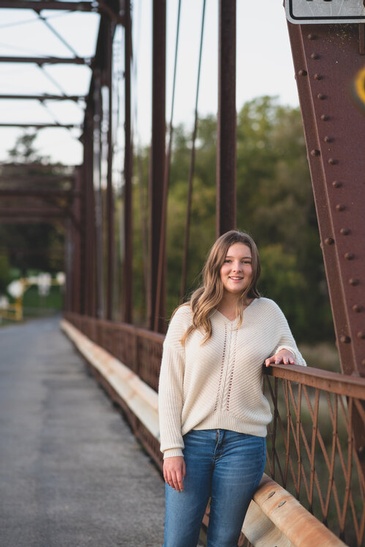 Girl Leaning on Bridge Railing - Family Portrait Photography Hamilton by Devon Crowell